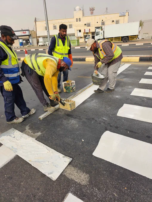 Part of the maintenance work of painting the pedestrian lines